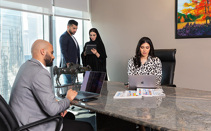 Servcorp Meeting Room with people meeting and presenting using high-tech, fully equipped facilities.